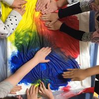 Kids learning primary colors by mixing red yellow and blue at Lessard Playschool
