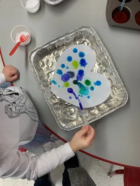 Fizzing heart craft in preschool programs at Lessard Playschool
