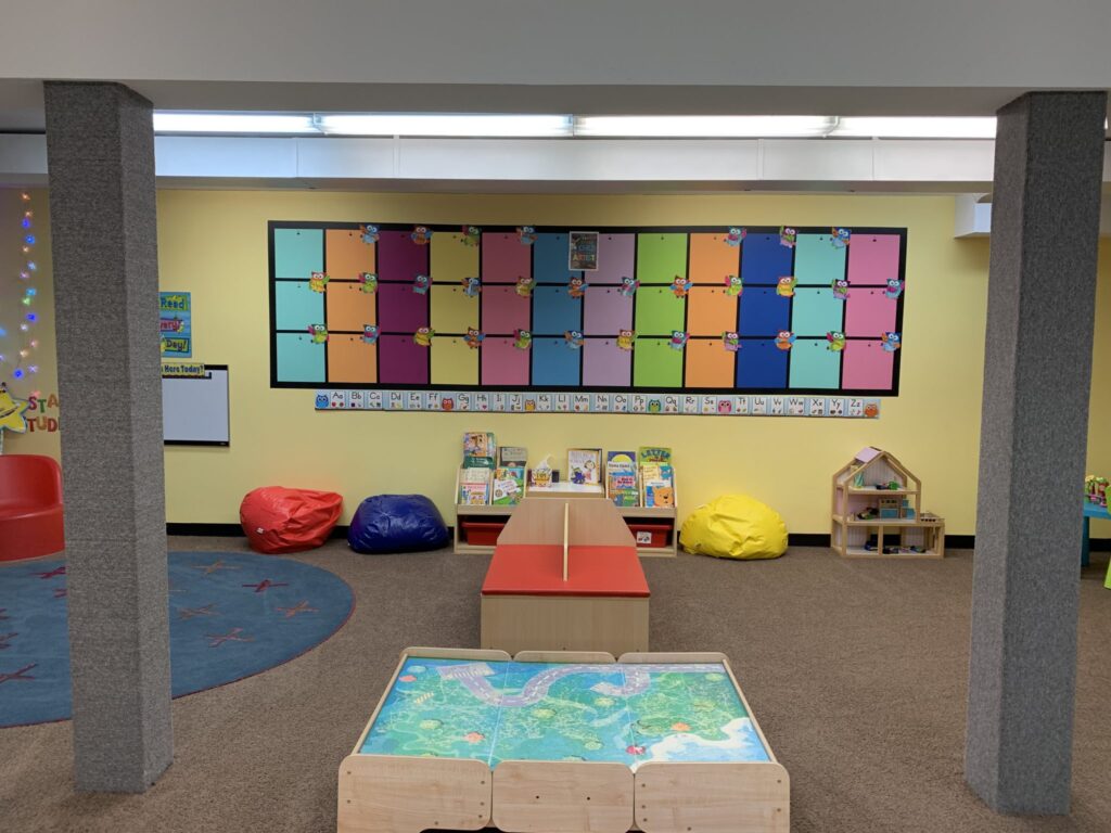 art wall showcase book nook and play area at Lessard Playschool preschool program west Edmonton