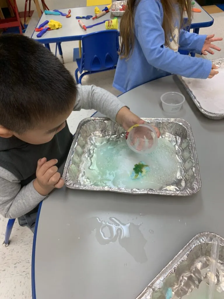 Kids discovery dinosaur fossil science experiment at Lessard Playschool preschool program